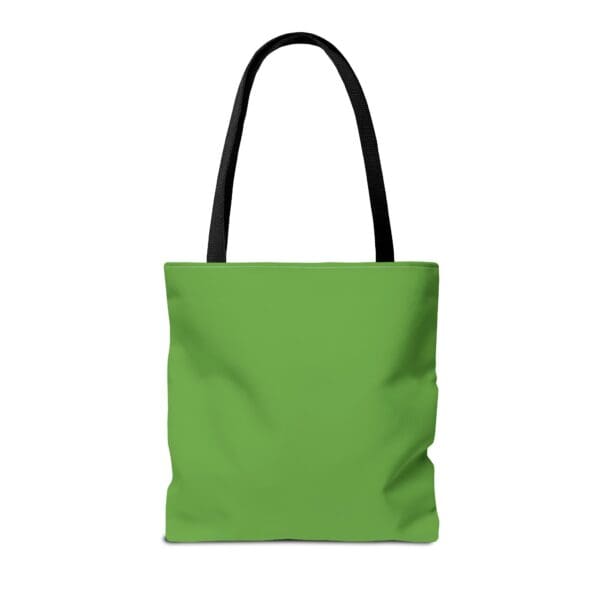 A green tote bag with black handles.