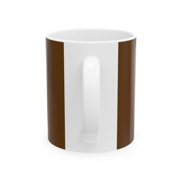 A coffee mug with brown stripes on it.