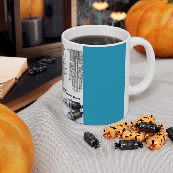 A cup of coffee and some candy on the table.