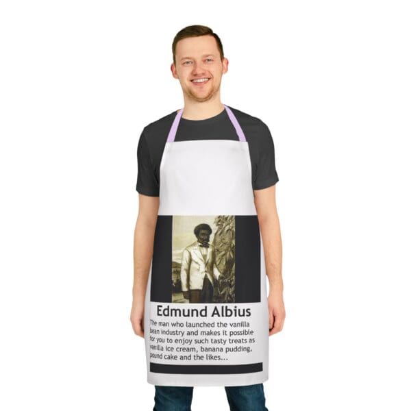 A man wearing an apron with the name of edmund abius on it.