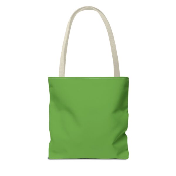 A green tote bag with white handles.