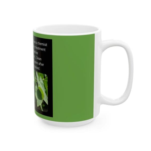 A white coffee mug with a picture of leaves.