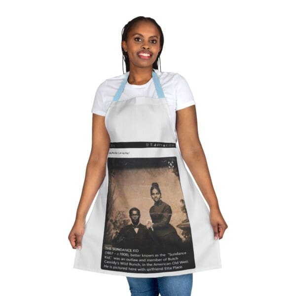 A woman wearing an apron with a picture of two people.