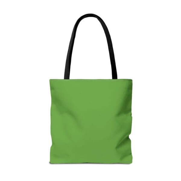 A green tote bag with black handles and an image of a person.