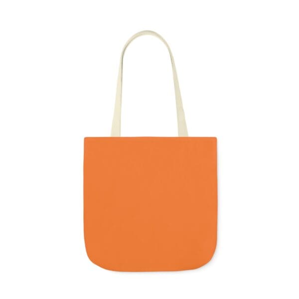 A bag with an orange background and white handles.