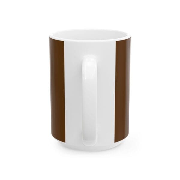 A white coffee mug with brown stripes on the bottom.