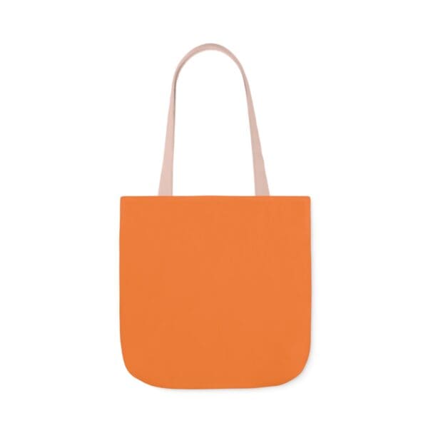 A bag that is orange and has two handles.