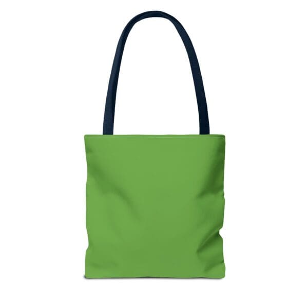 A green tote bag with black handles and an image of a person.