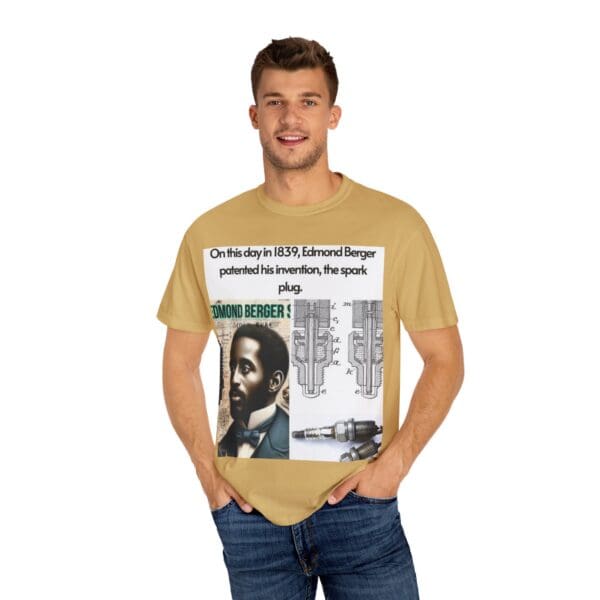 A man wearing a tan t-shirt with a picture of a person.