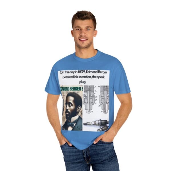 A man wearing a blue t-shirt with newspaper pictures on it.