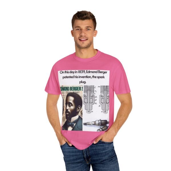 A man wearing a pink t-shirt with a picture of a person.