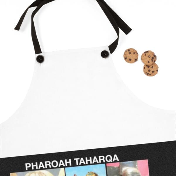 A white apron with pictures of people and cookies.