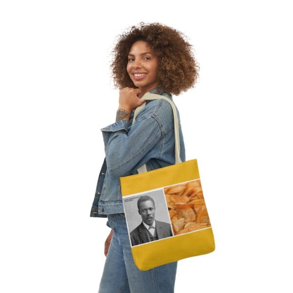 A woman holding onto a bag with an image of a man.