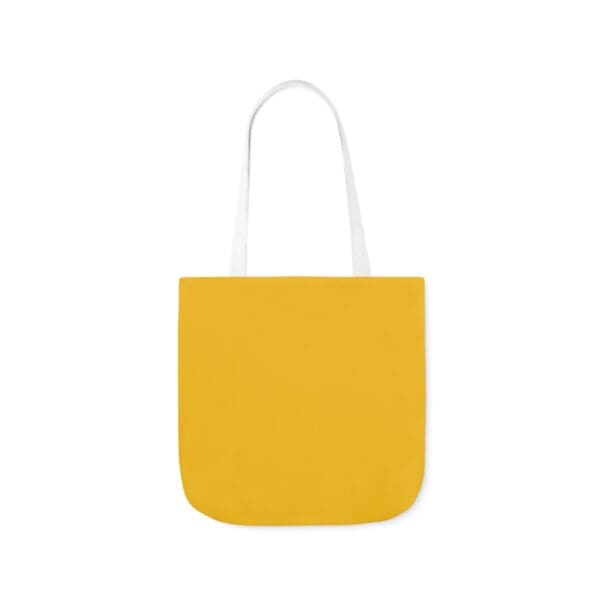 A yellow bag with white handles and a white handle.