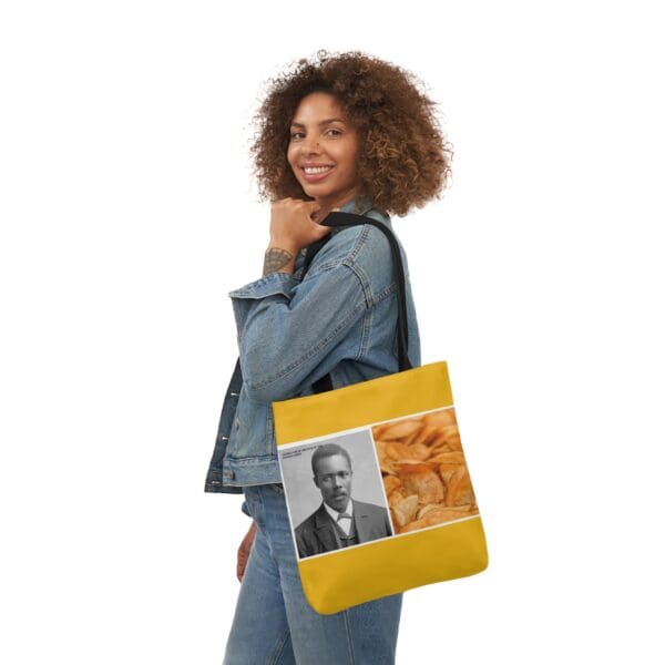 A woman holding onto a bag with an image of a man.