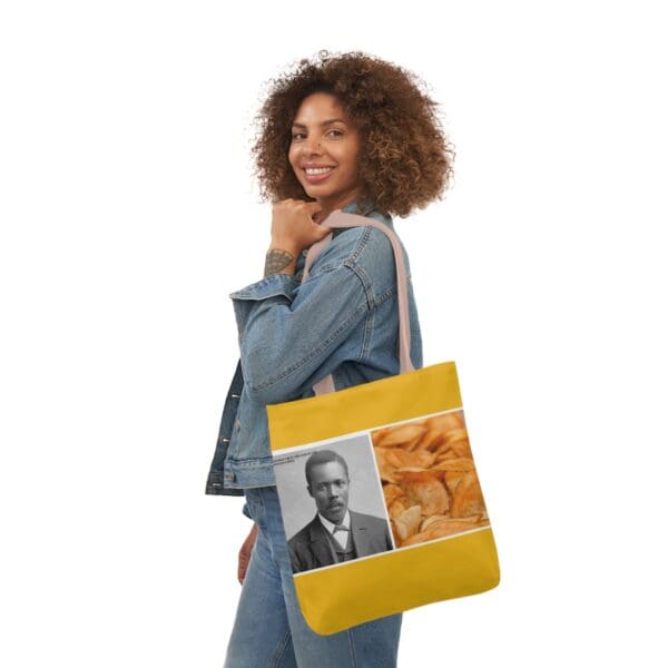 A woman holding onto a yellow bag with an image of a man.