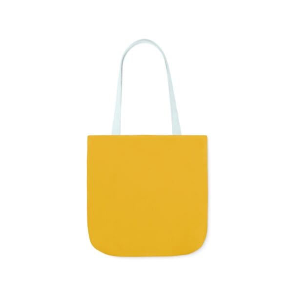 A yellow bag with white handles and a white handle.