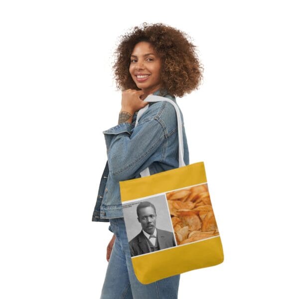 A woman holding onto a bag with an image of a man