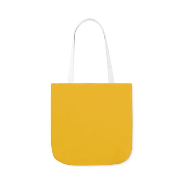 A yellow bag with white handles and a white handle.