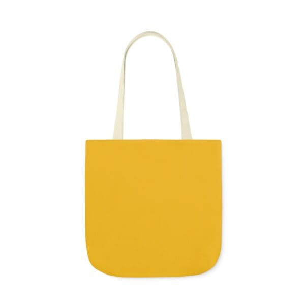 A yellow bag with handles on top of it.